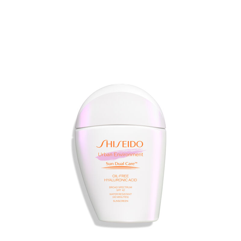 A  closed,rounded white bottle of Shiseido Urban Environment Oil-Free Sunscreen SPF 42 30mL against a white background. The label includes the product name, as well as describing that it is oil-free, contains hyaluronic acid, is a broad spectrum product,and is water resistant up to 40 minutes. The image also states that this product is recommended for daily use by the Skin Cancer Foundation, and it is also a US Winner for Marie Claire’s Prix D’Excellence De La Beauté 2023.