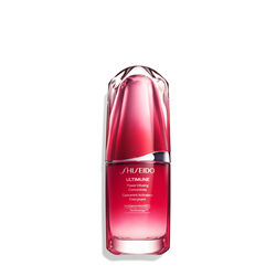 A red, cylindrical bottle of Shiseido Ultimune Power Infusing Serum. The text on the bottle says the title in both English and French, and it indicates that the formula contains “ImuGenerationRED Technology.” 