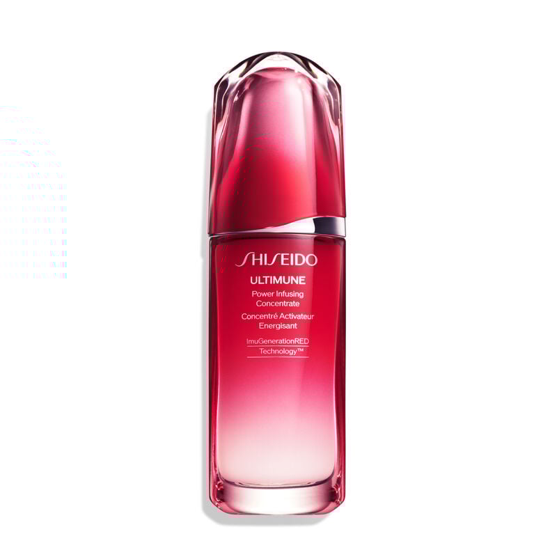 A red, cylindrical bottle of Shiseido Ultimune Power Infusing Serum. The text on the bottle says the title in both English and French, and it indicates that the formula contains “ImuGenerationRED Technology.”