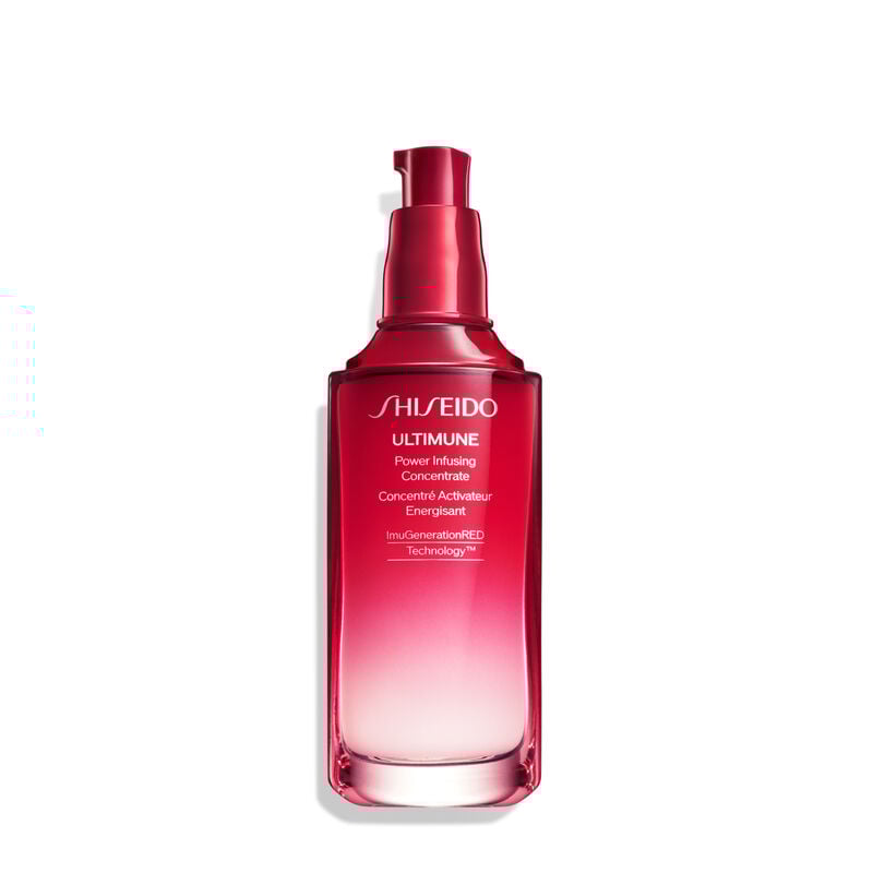 A red, open cylindrical bottle of Shiseido Ultimune Power Infusing Serum, without the cap,revealing the pump dispenser. The text on the bottle says the title in both English and French, and it indicates that the formula contains “ImuGenerationRED Technology.”