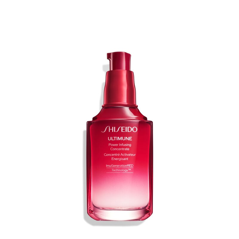 A red, open cylindrical bottle of Shiseido Ultimune Power Infusing Serum, without the cap,revealing the pump dispenser. The text on the bottle says the title in both English and French, and it indicates that the formula contains “ImuGenerationRED Technology.”