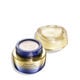 An open jar of Shiseido Vital Perfection Uplifting and Firming Advanced Cream. The jar reveals the creamy white product inside. It's labeled with the product name, as well as the words "ReNeuraRED Technology."