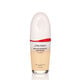 An oval-shaped bottle of the Shiseido Revitalessence Skin Glow Foundation SPF 30 in shade 130 Opal. The label on the bottle is white with a red accent. El texto en la etiqueta muestra el título del producto, y su protección solar.
